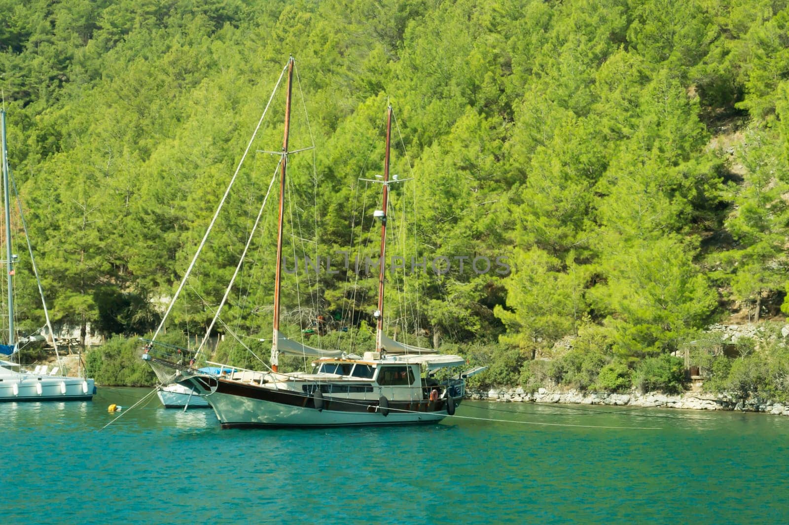Recreation on the boat near the shore of a mountain
