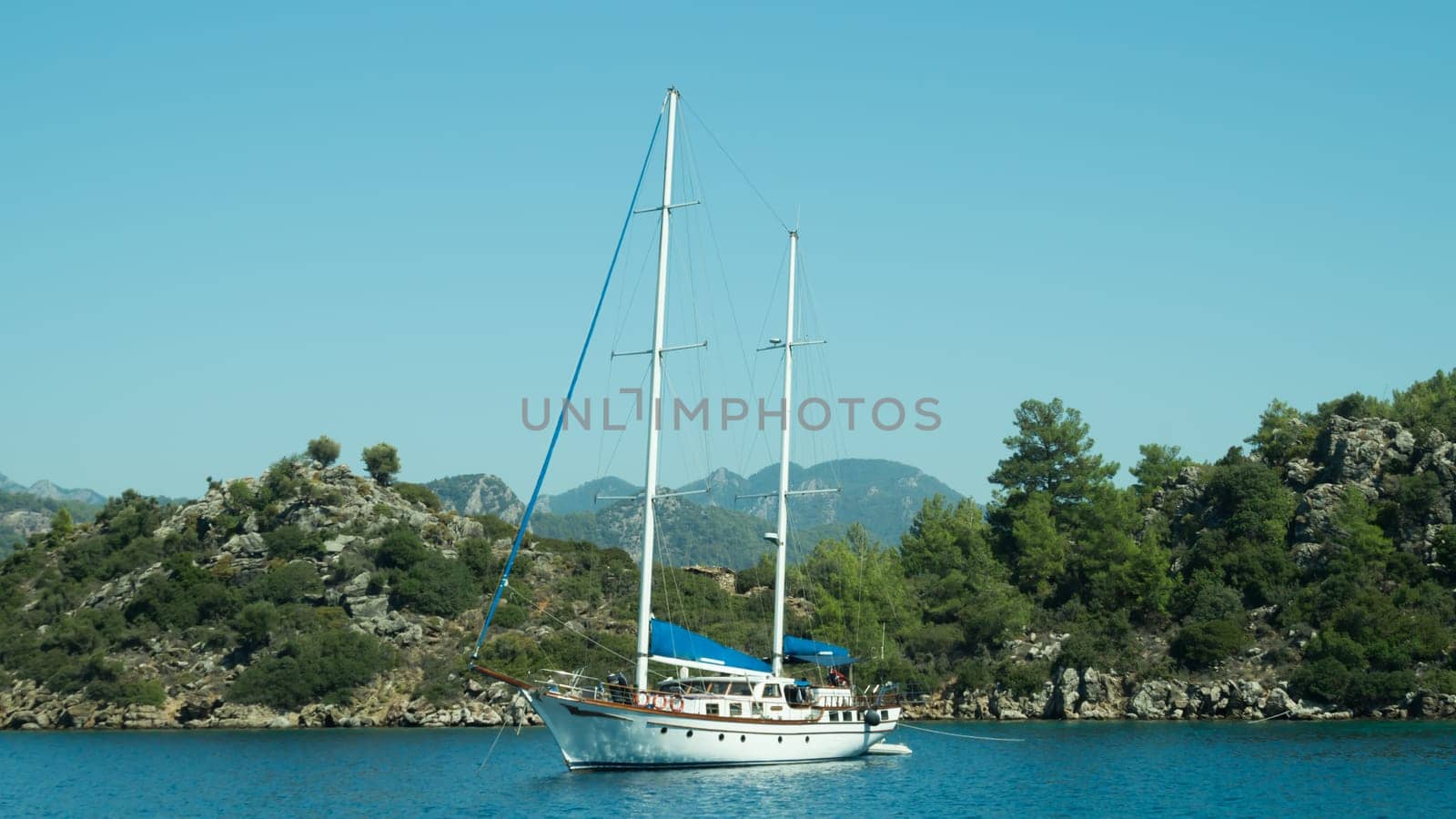 Recreation on the boat near the shore of a mountain