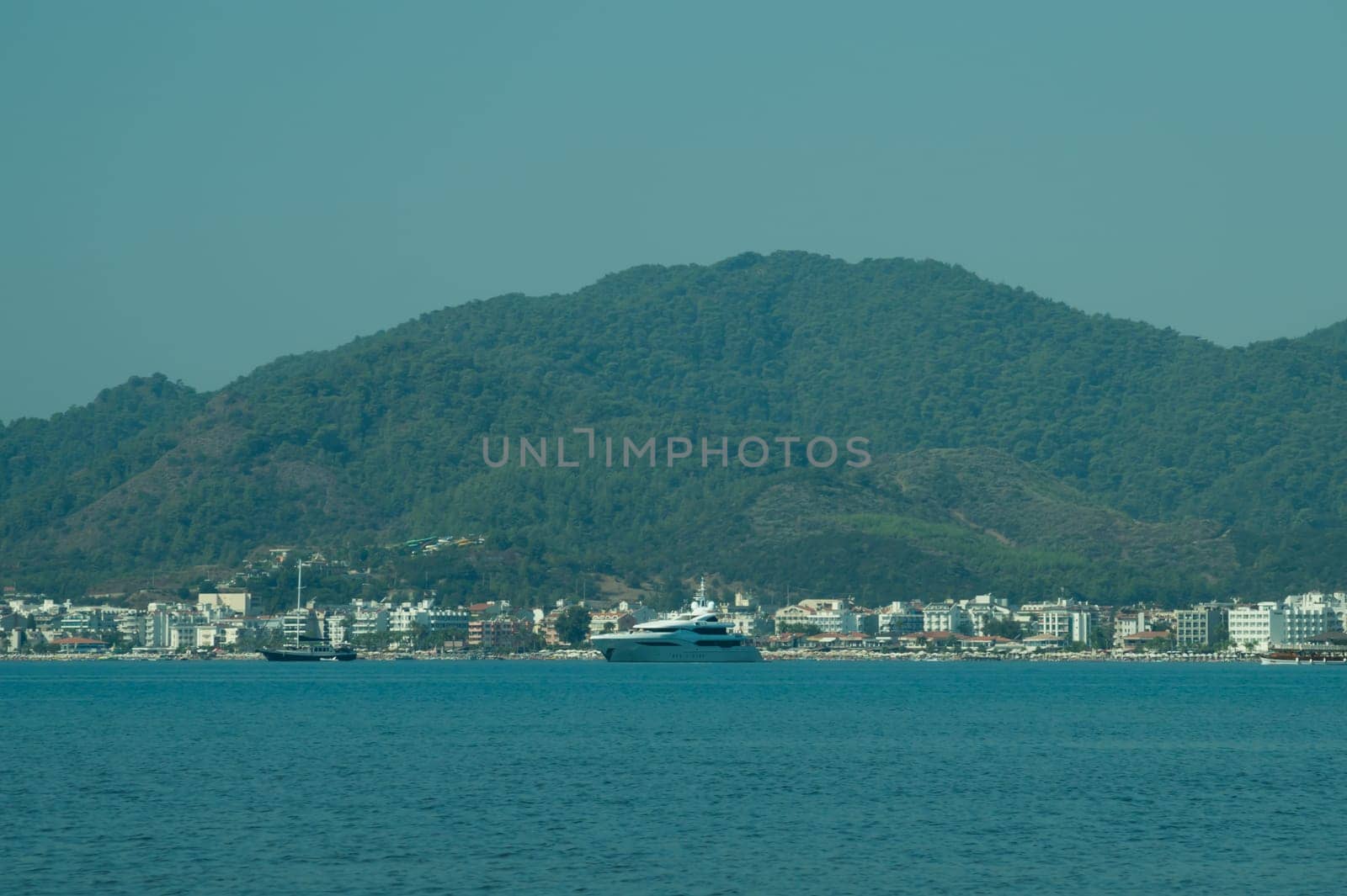 Recreation on the boat near the shore of a mountain