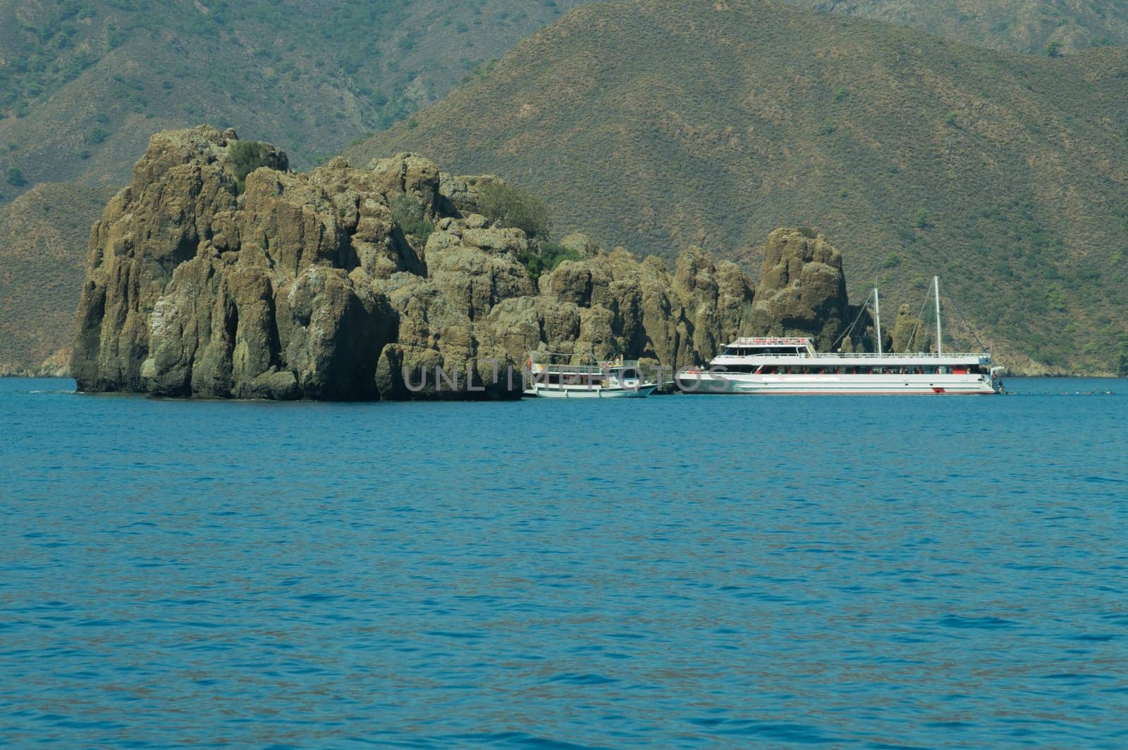 Recreation on the boat near the shore of a mountain