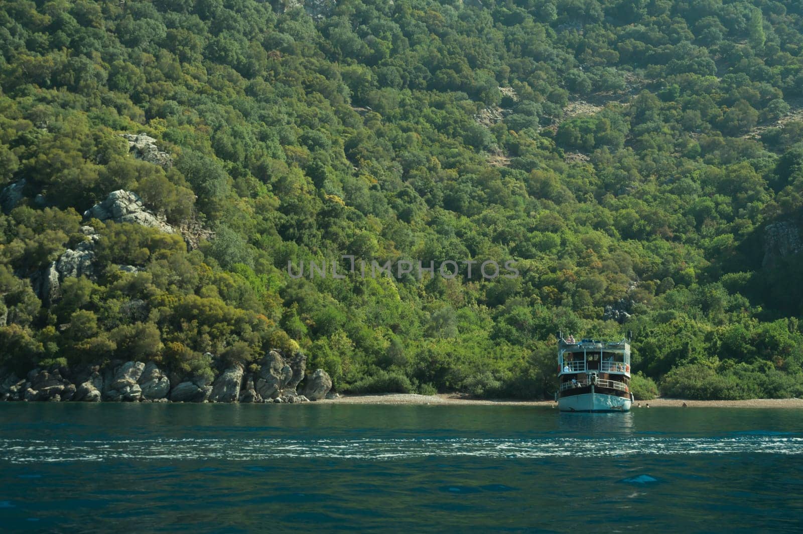 Recreation on the boat near the shore of a mountain