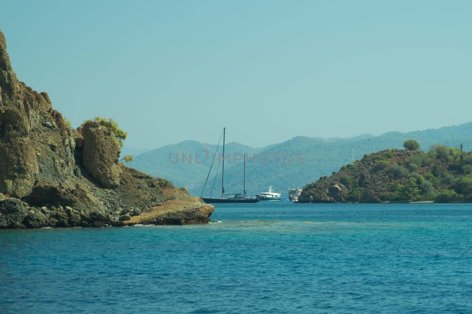 Recreation on the boat near the shore of a mountain