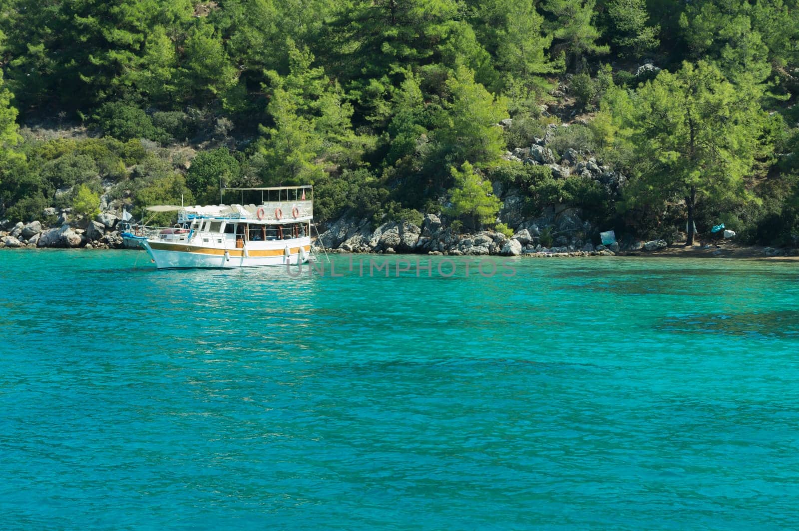 Recreation on the boat near the shore of a mountain