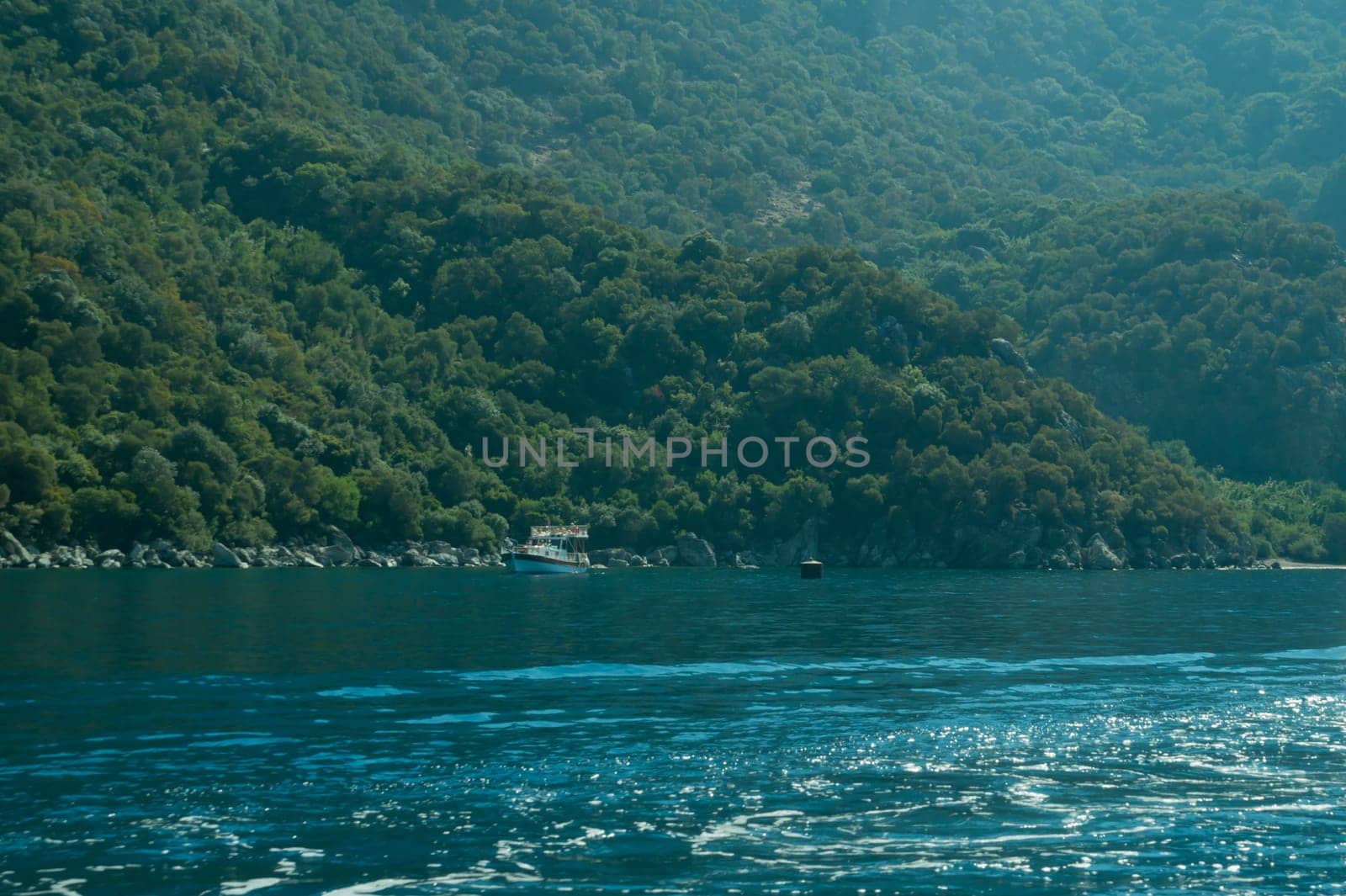 Recreation on the boat near the shore of a mountain