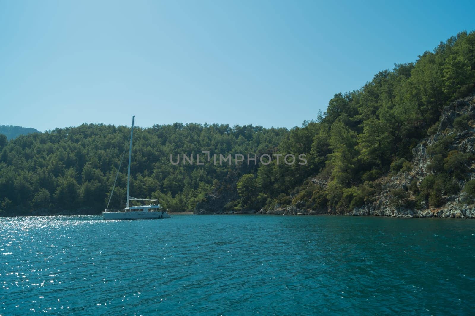 Recreation on the boat near the shore of a mountain