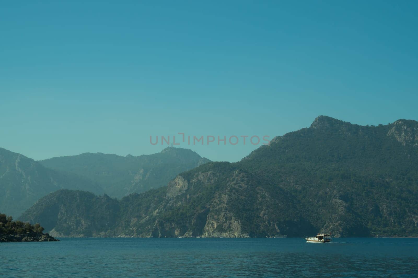 Recreation on the boat near the shore of a mountain