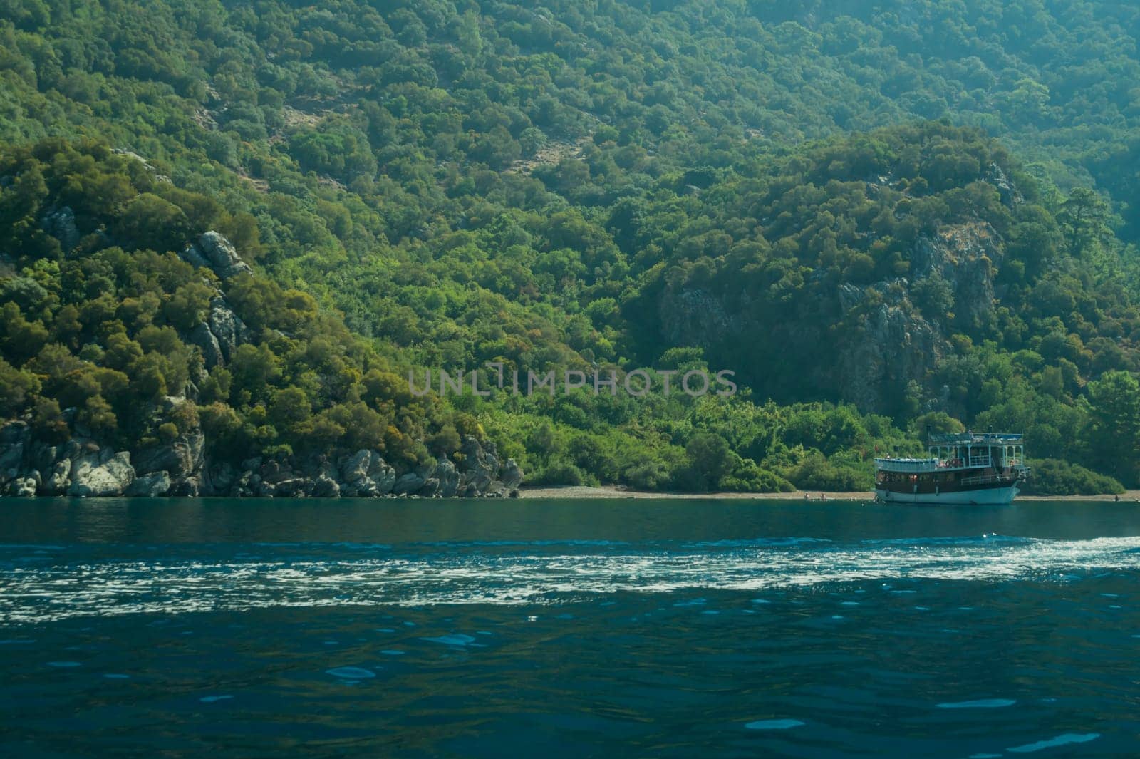 Recreation on the boat near the shore of a mountain