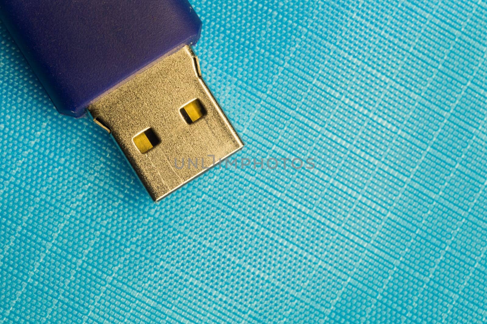 Memory stick isolated on blue background. usb flash drive macro. copy space
