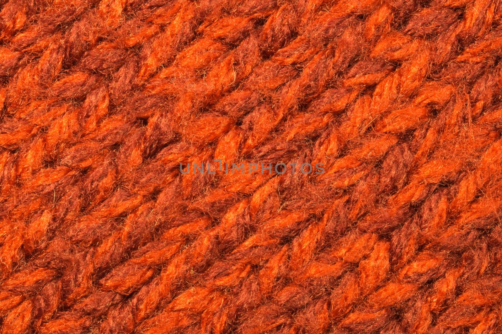 Christmas background from red knitted wool. macro view