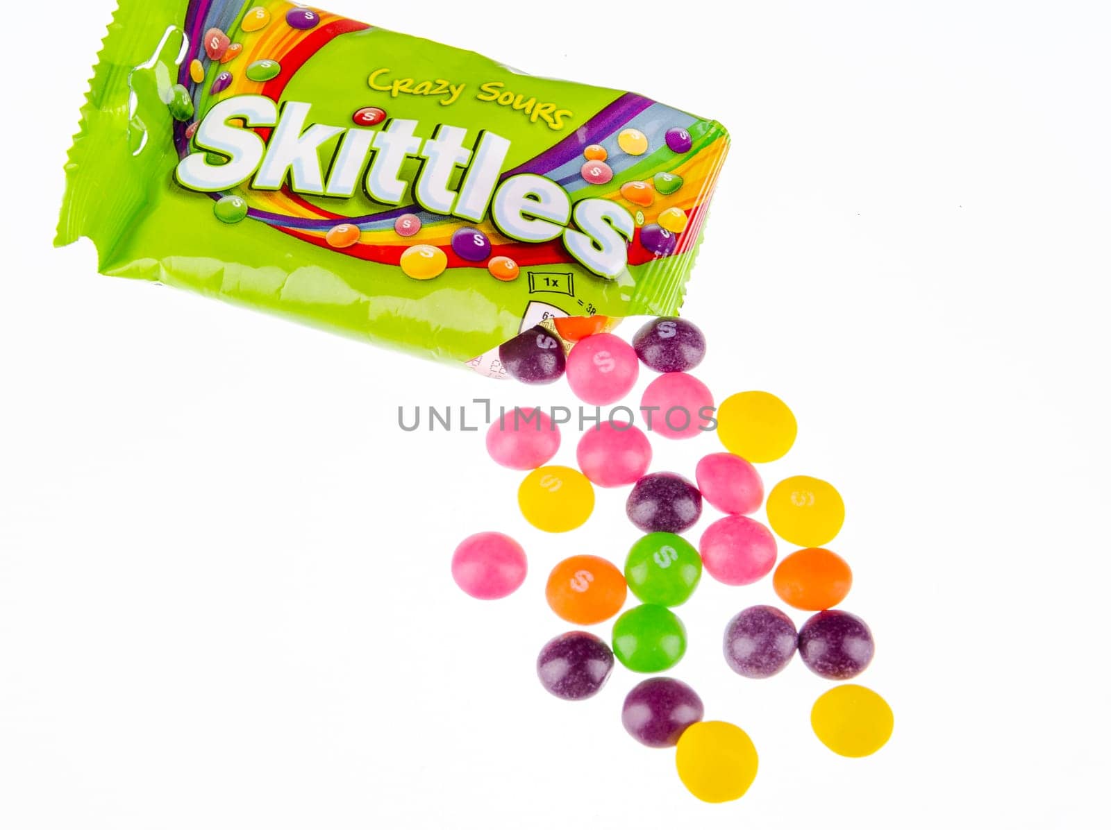 Skittles fruit-flavoured candies isolated on white background. Nowadays Skittles produced and marketed by the Wrigley Company Wrigley Company a division of Mars Incorporated, USA.