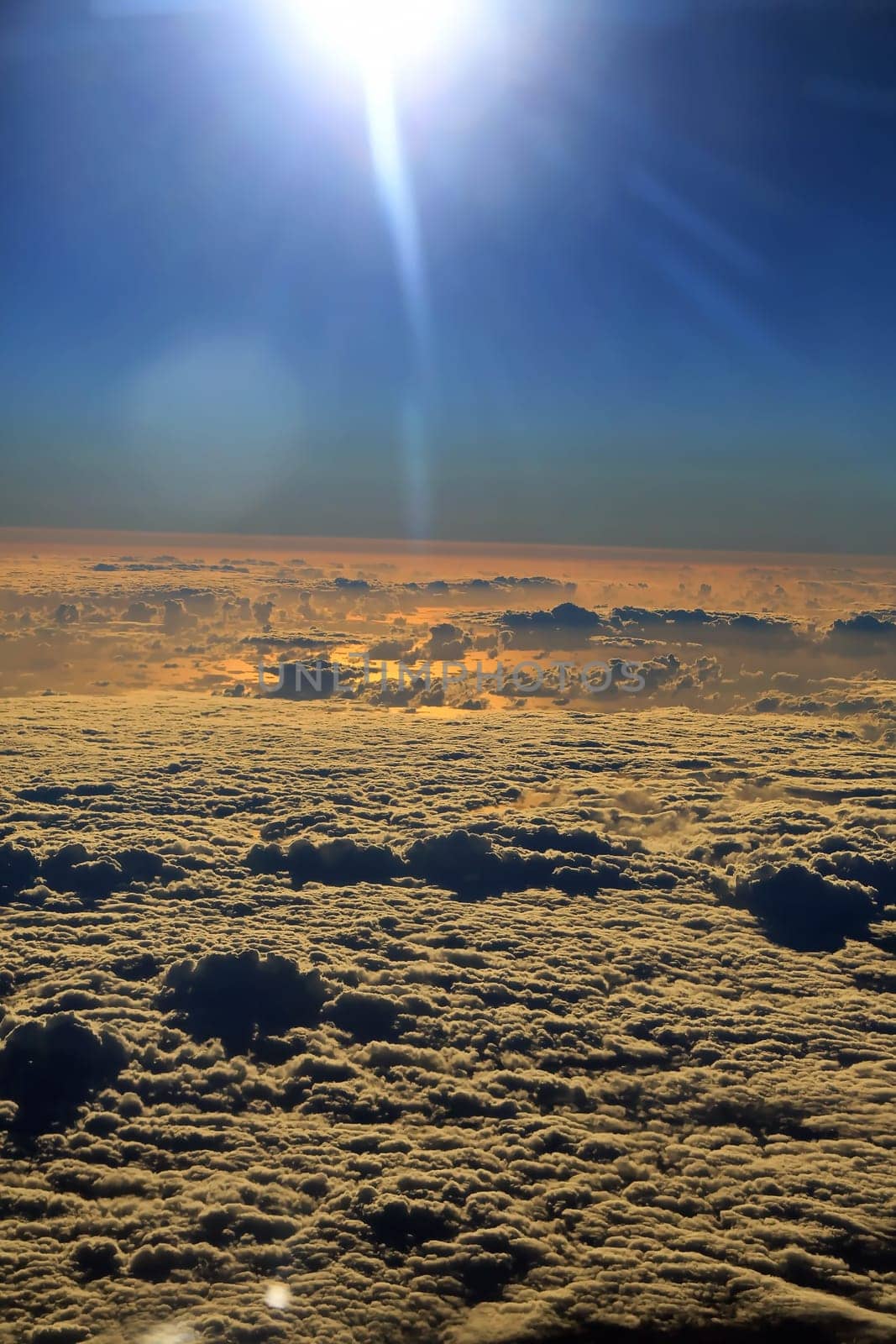 Window seat, a flight in the sunset