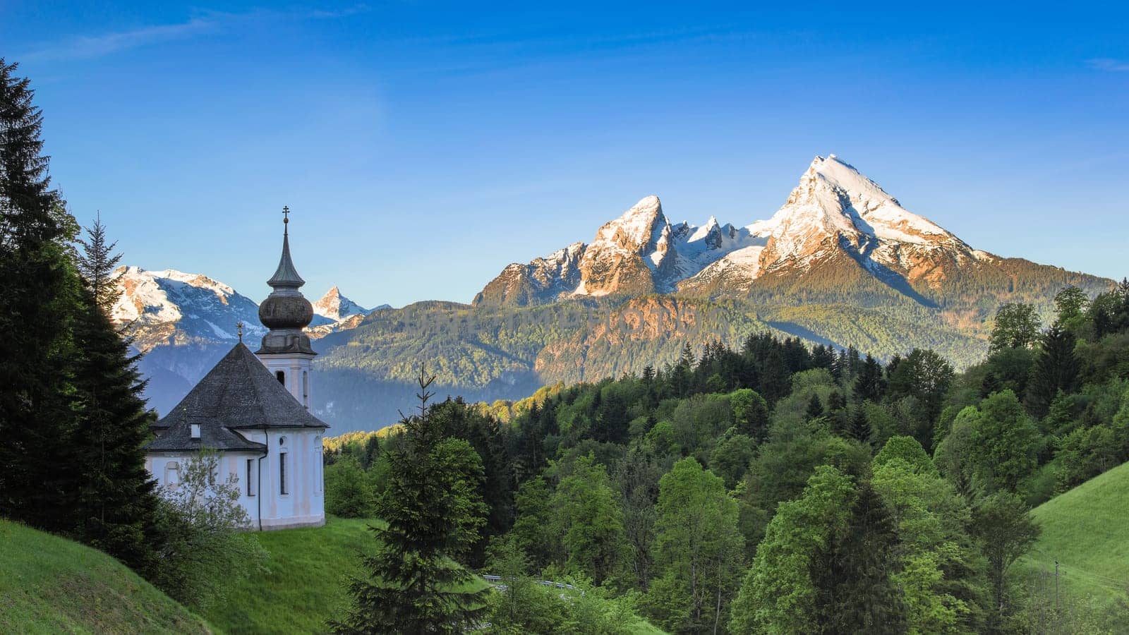 Destination scenery in Bavarian national park Berchtesgaden with Maria Gern chapel and snowy Watzmann mountain