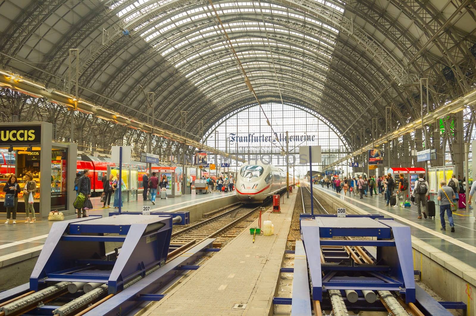 FRANKFURT, GERMANY - AUGUST 29, 2018: Modern train arrives to Frankfurt am Main Train station. People waiting for boarding