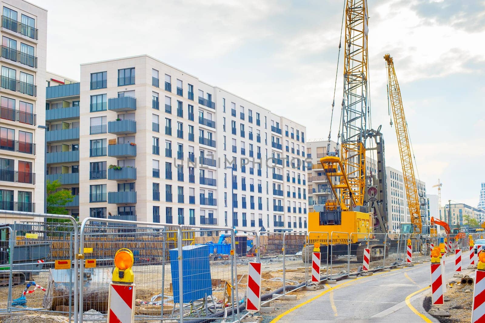 Excavator, cranes and construction equipment at construction site in downtown of Frankfurt , Germany