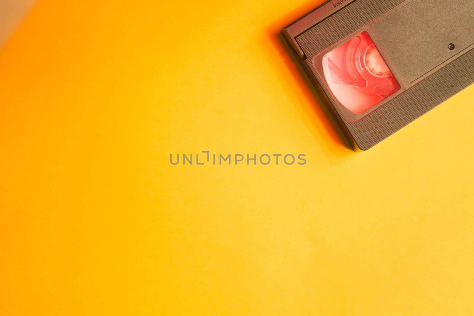 Video cassette isolated on yellow background. vhs with copy space