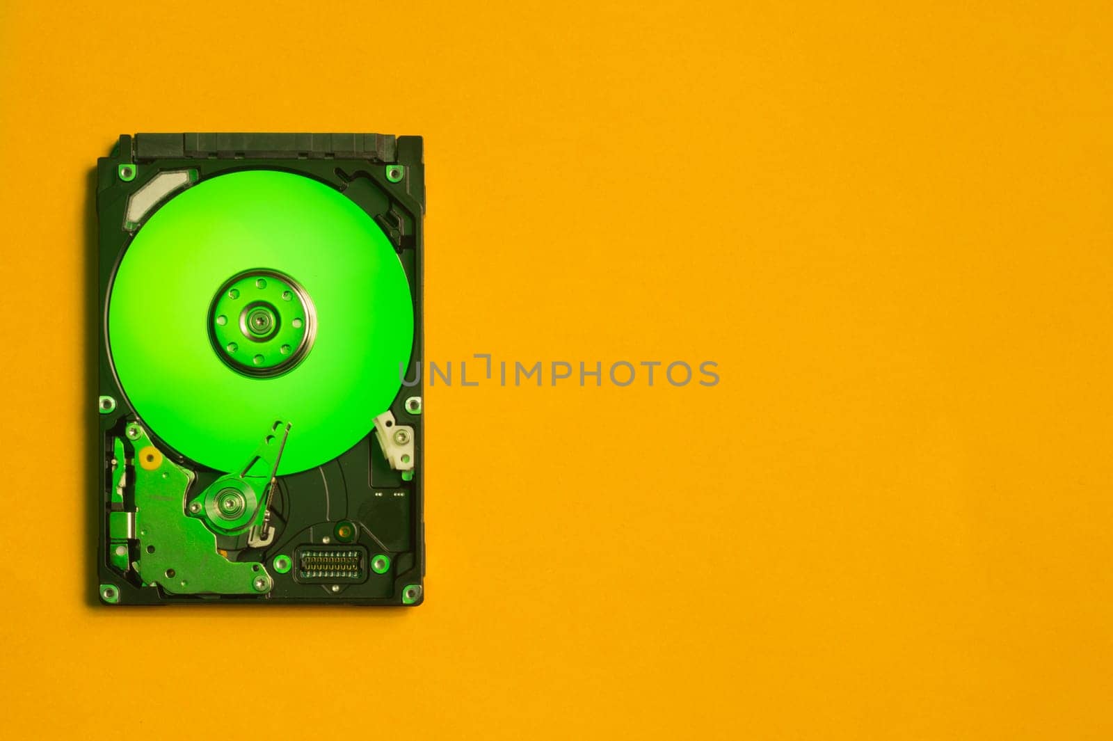 Colorful hdd. open hard disk drive. The concept of data storage. data array. hard drive from the computer. hdd with mirror effect. copy space