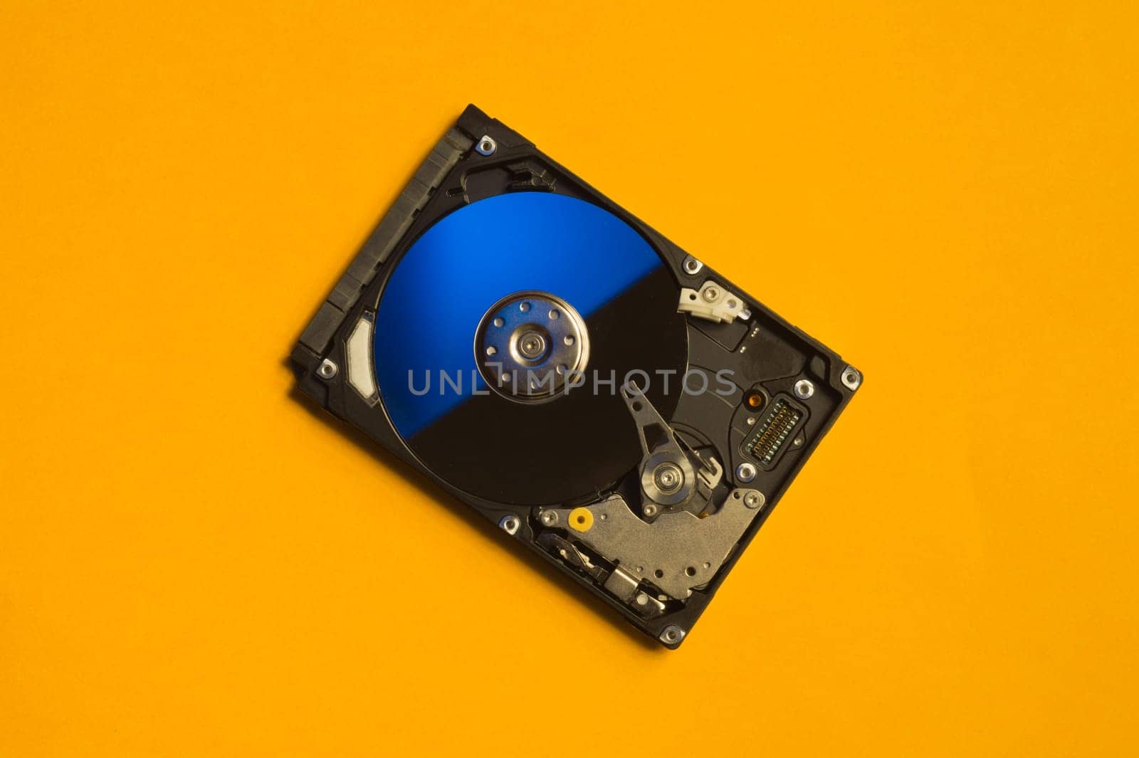 Colorful hdd. open hard disk drive. The concept of data storage. data array. hard drive from the computer. hdd with mirror effect. copy space
