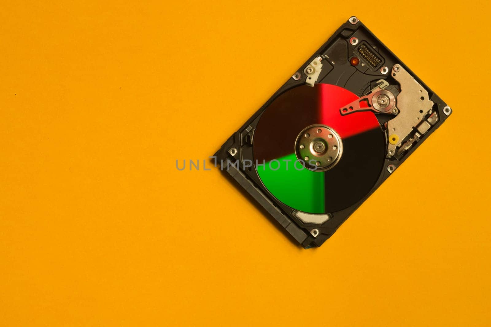 Colorful hdd. open hard disk drive. The concept of data storage. data array. hard drive from the computer. hdd with mirror effect. copy space