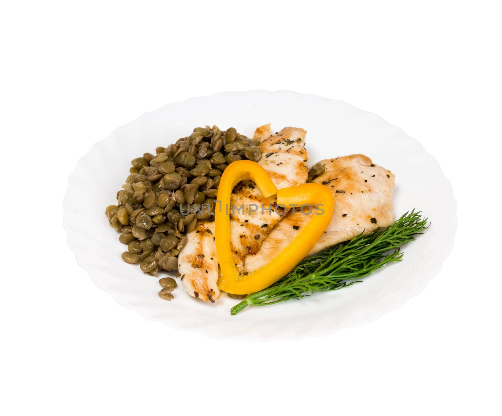grilled chicken fillet with lentils on a white plate and isolated on white background