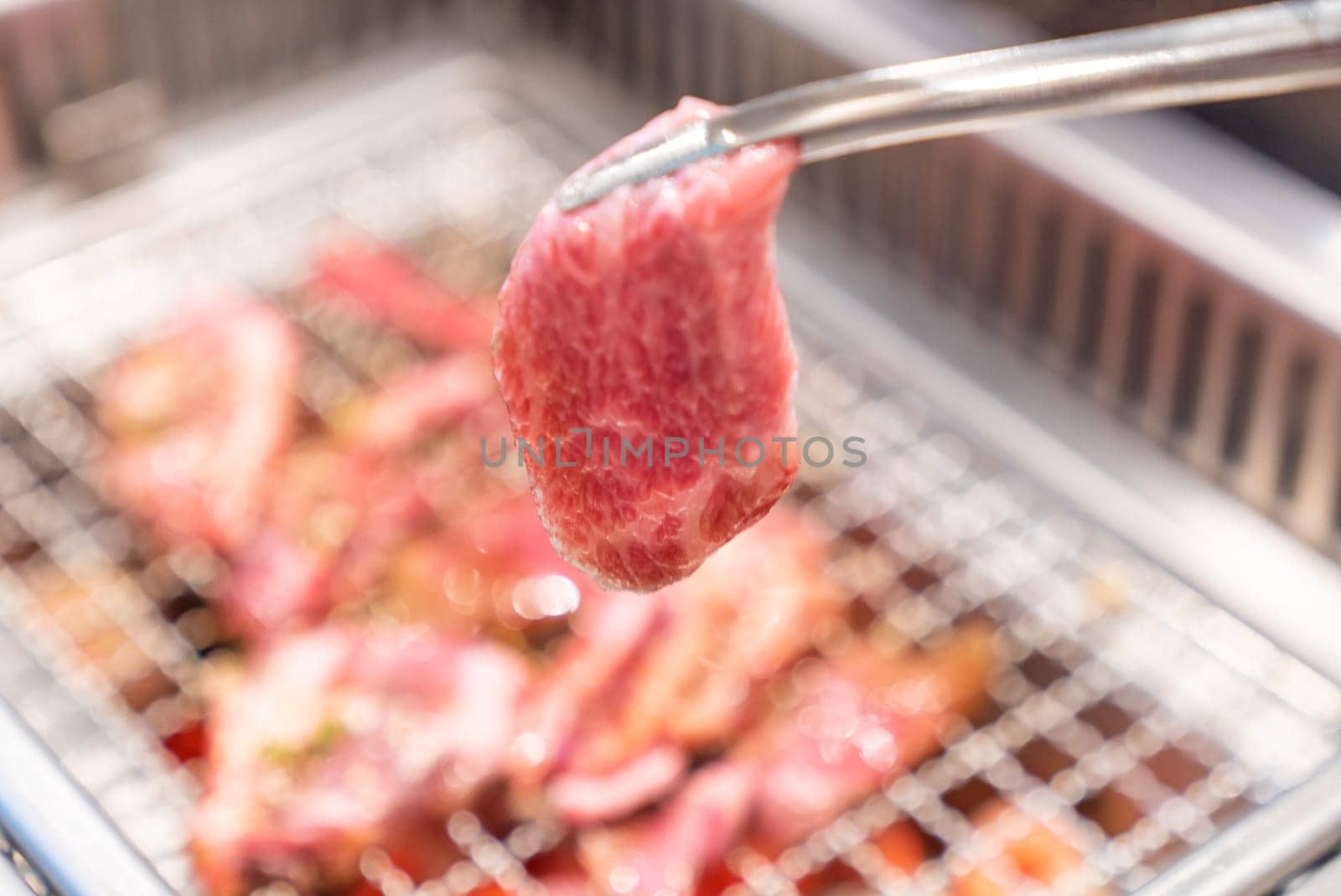 grilled japanese wagyu premium beef yakiniku with red hot charcoal
