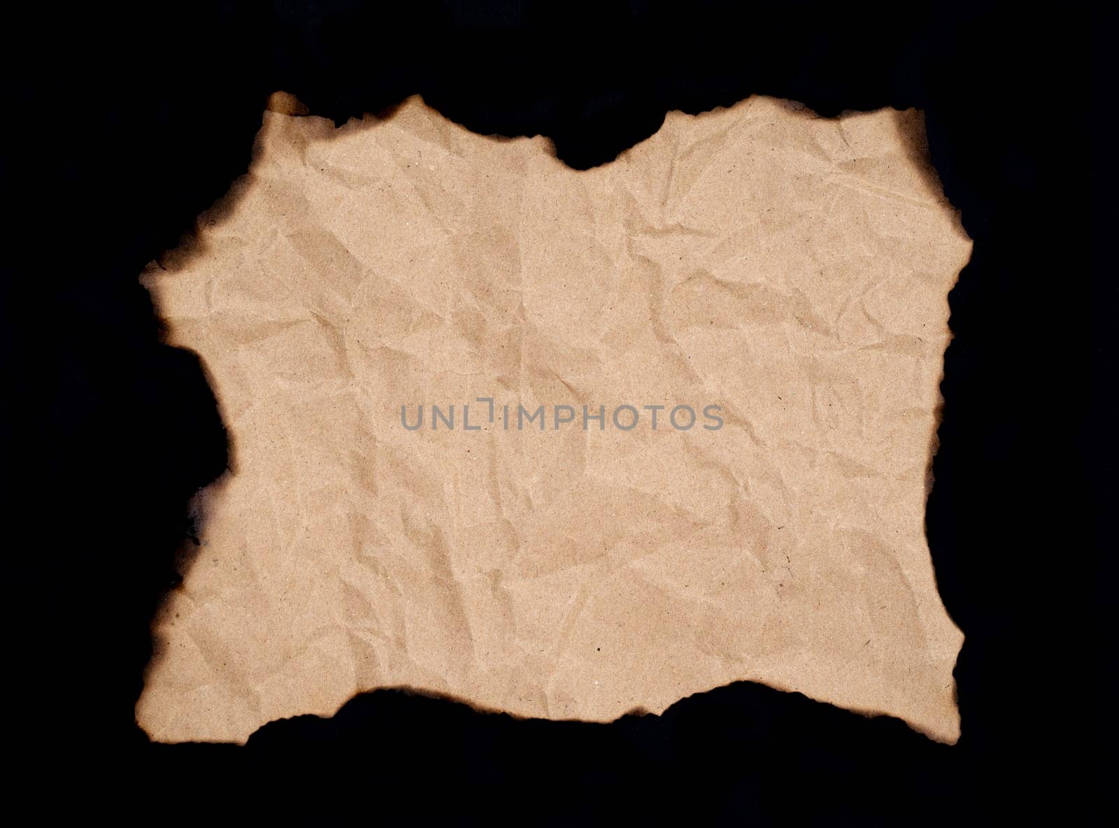 burnt paper sheet isolated on black background