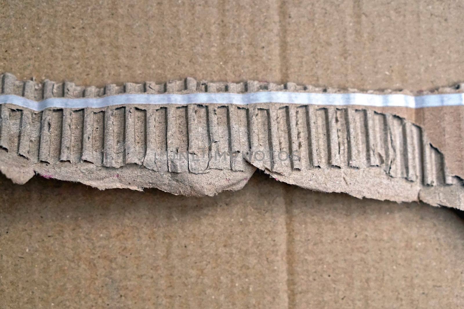 Pull to open strip at cardboard box