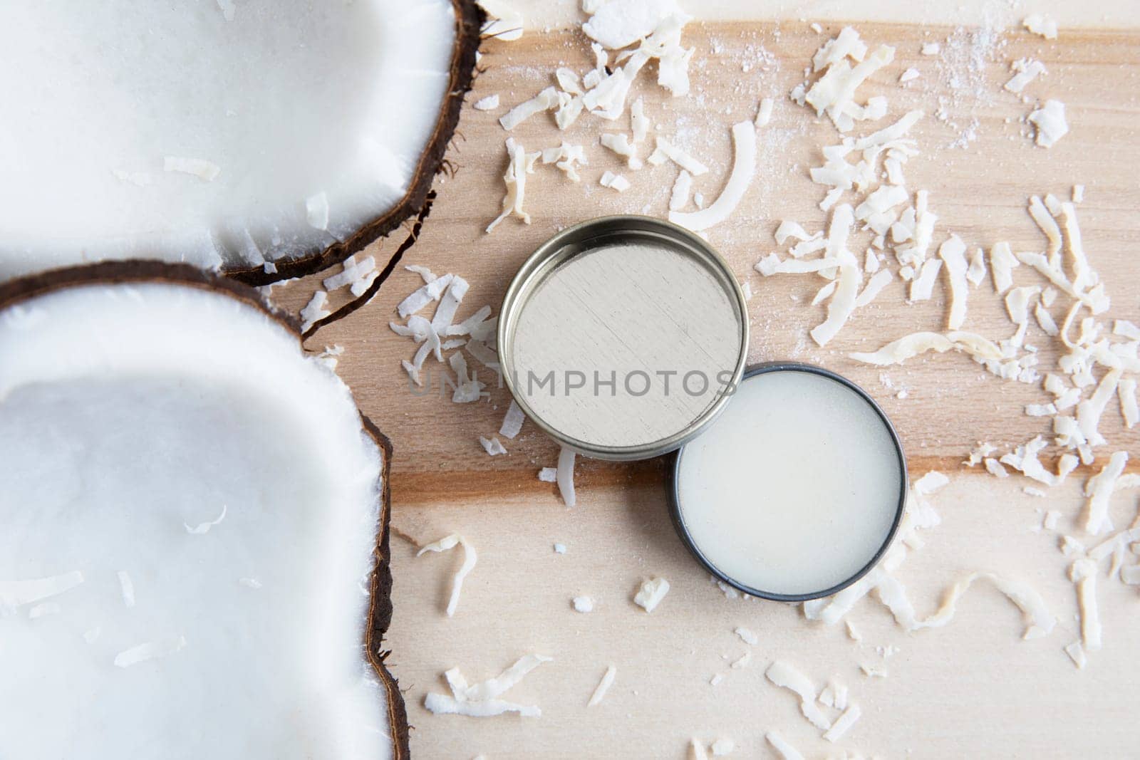 Coconuts with coconut cosmetic cream from a top down view.