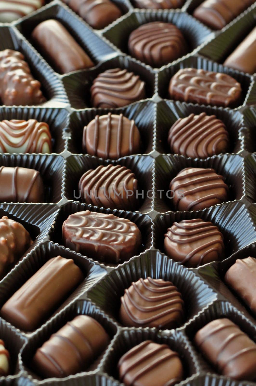 Box of chocolates sweet food candy background. Selective focus.