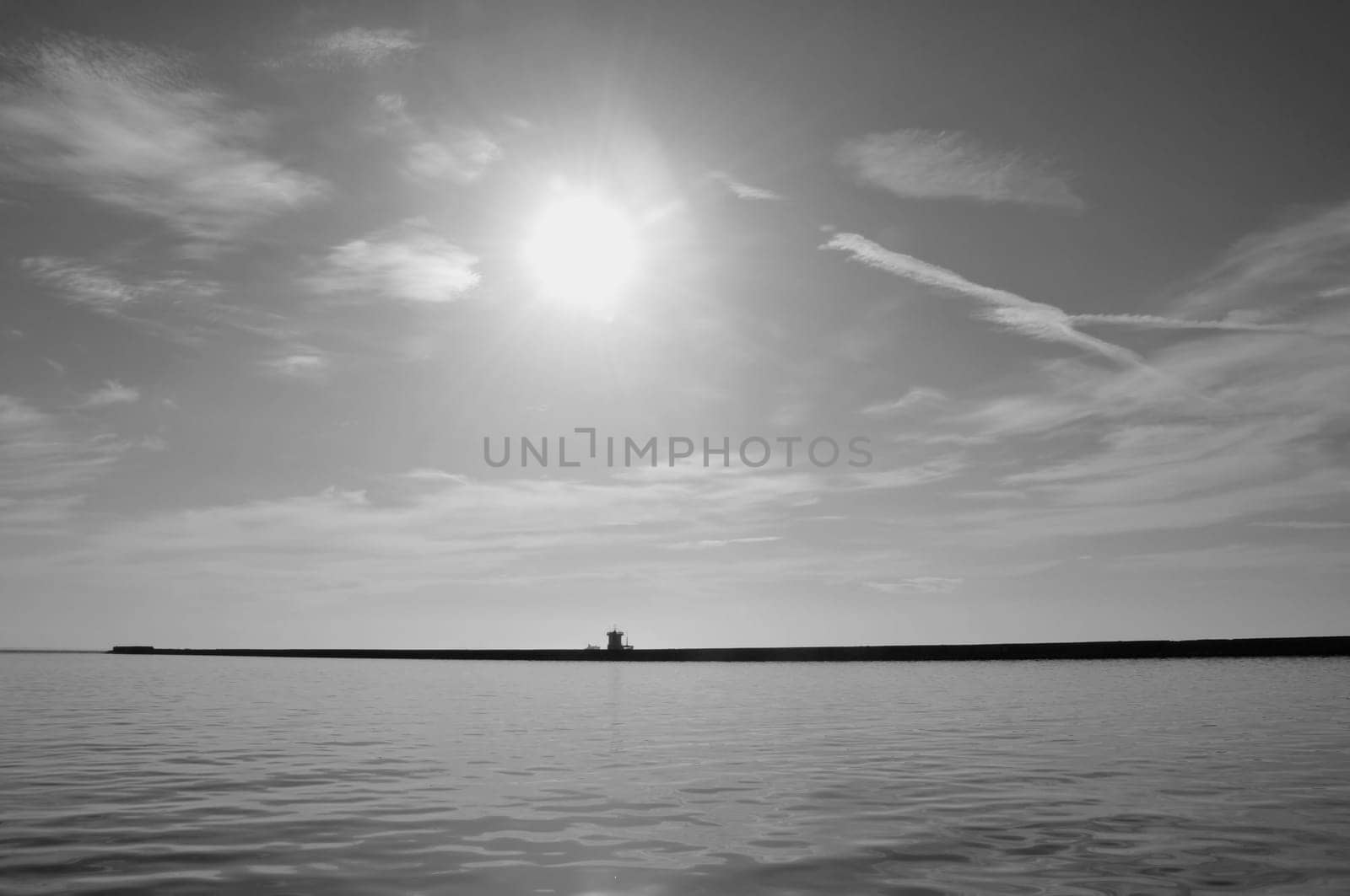 Pier wall sea and sunny sky horizon abstract seascape. Black and white.