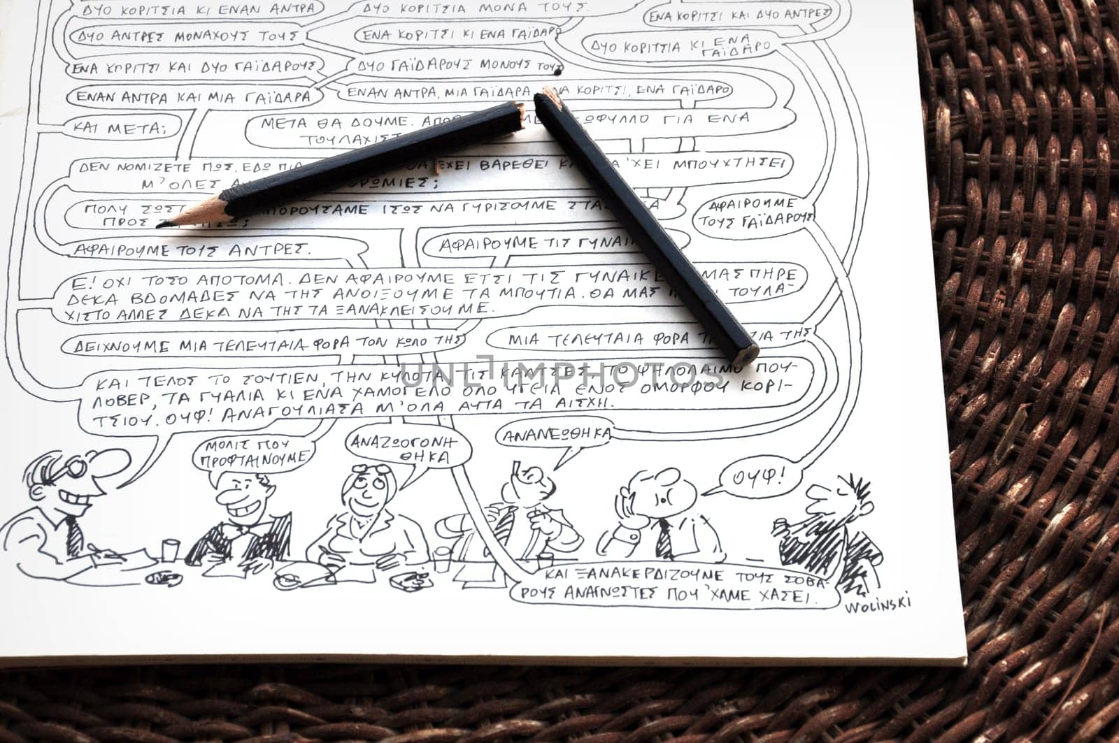 ATHENS, GREECE - JANUARY 8, 2015: Broken pencil on comic strip by cartoonist and writer Georges Wolinski (1934 - 2015) one of the victims of the terrorist attack at the headquarters of Charlie Hebdo newspaper on January 7, 2015 in Paris, France.