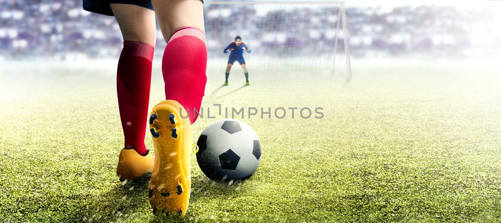 Football player woman in orange jersey kicking the ball in the penalty box on football field