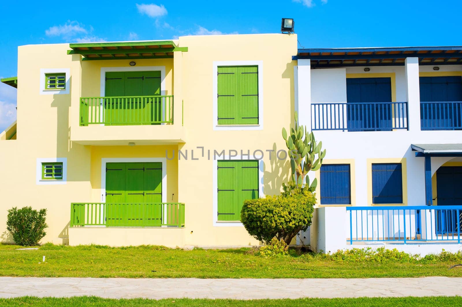Colorful tourist apartments in the sunny day. Front view. Paphos, Cyprus