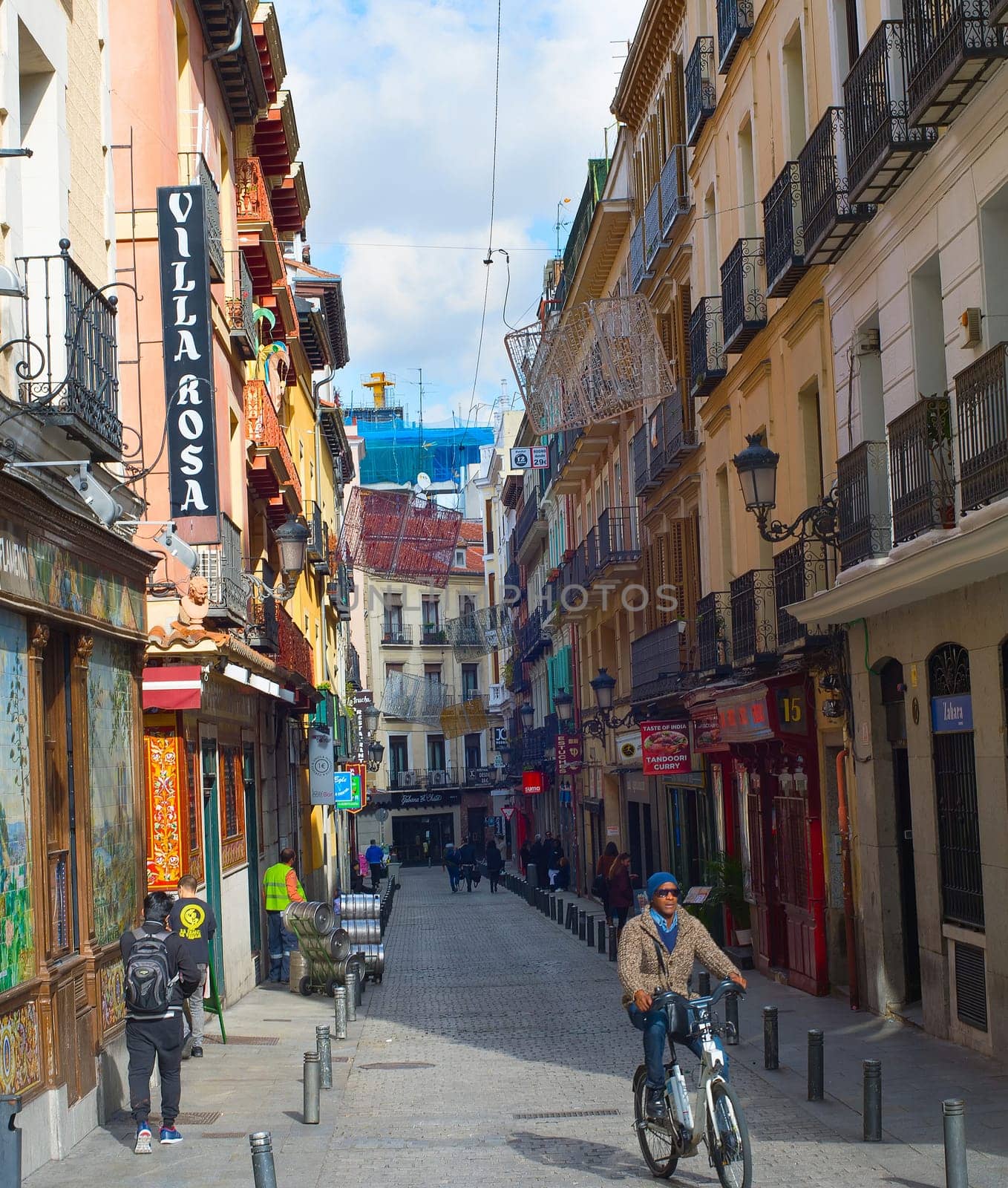 MADRID, SPAIN - NOVEMBER 07, 2016: People at an Old Town street in Madrid. Madrid is the capital of Spain.