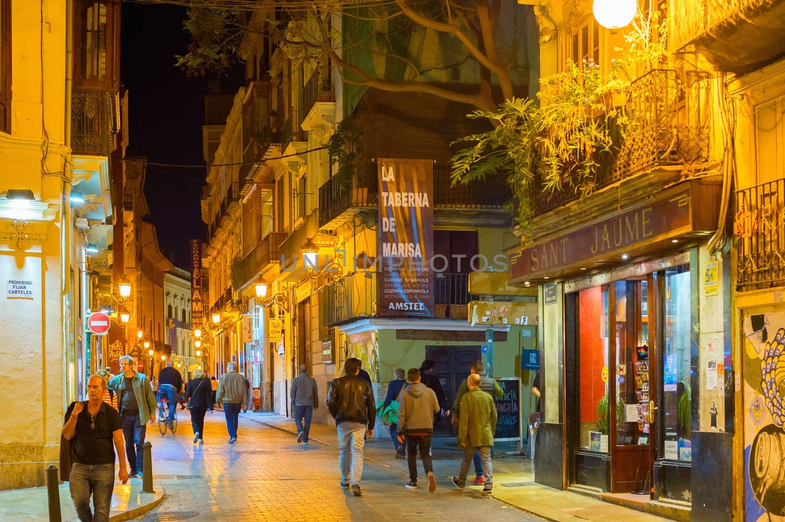 VALENCIA, SPAIN - NOVEMBER 5, 2016: People walking by Old Town street of Valencia, Spain