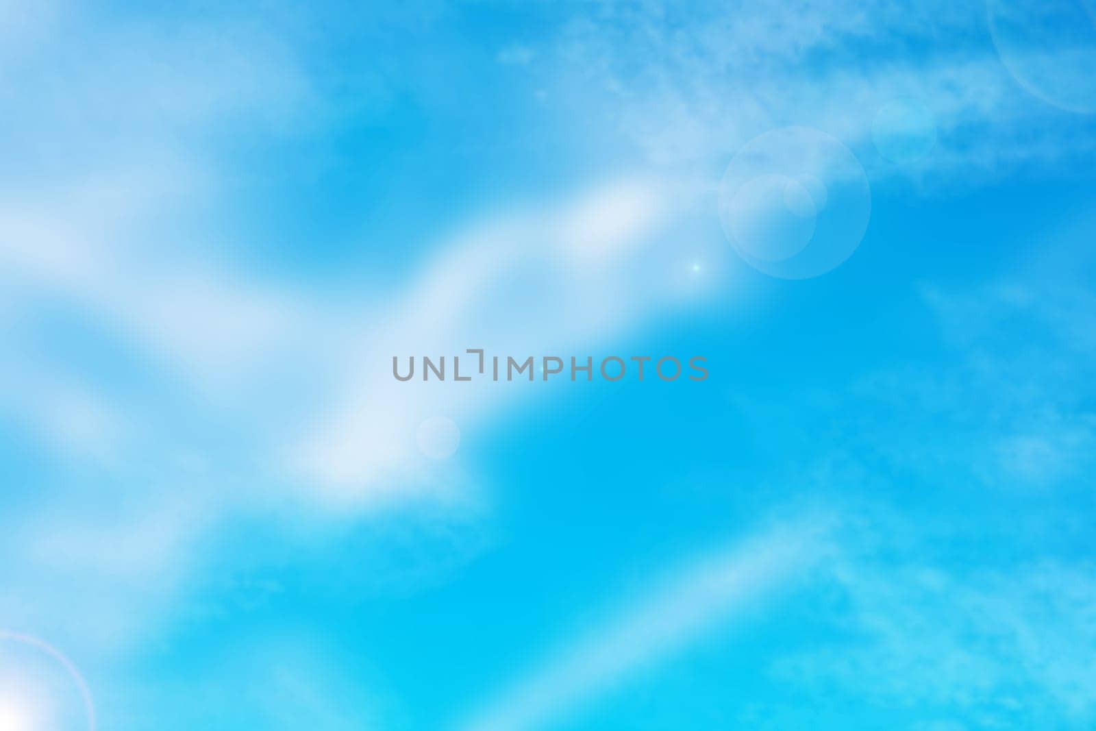Blue sky with cloud background. Abstract realistic blue sky with delicate fluffy clouds, stars and romantic glamourous sun flair light. Beautiful texture.