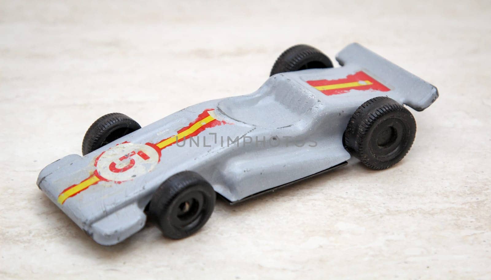 An old toy racing car, toy car