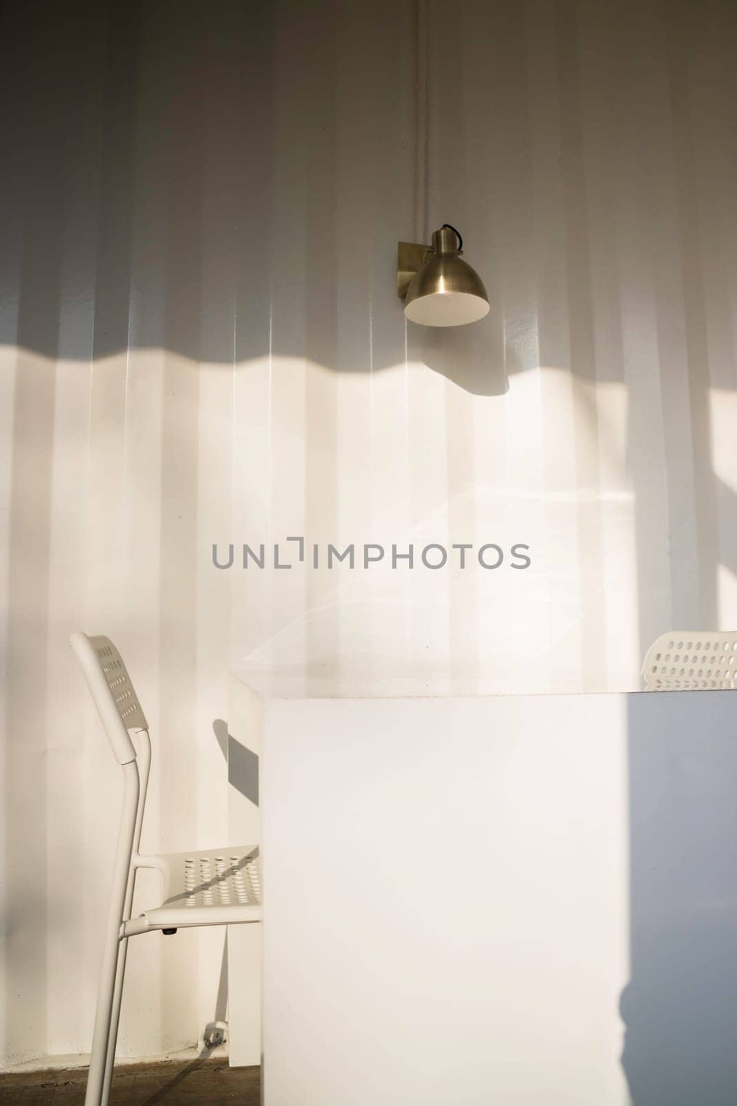 White table and chair in cargo container living room, stock photo