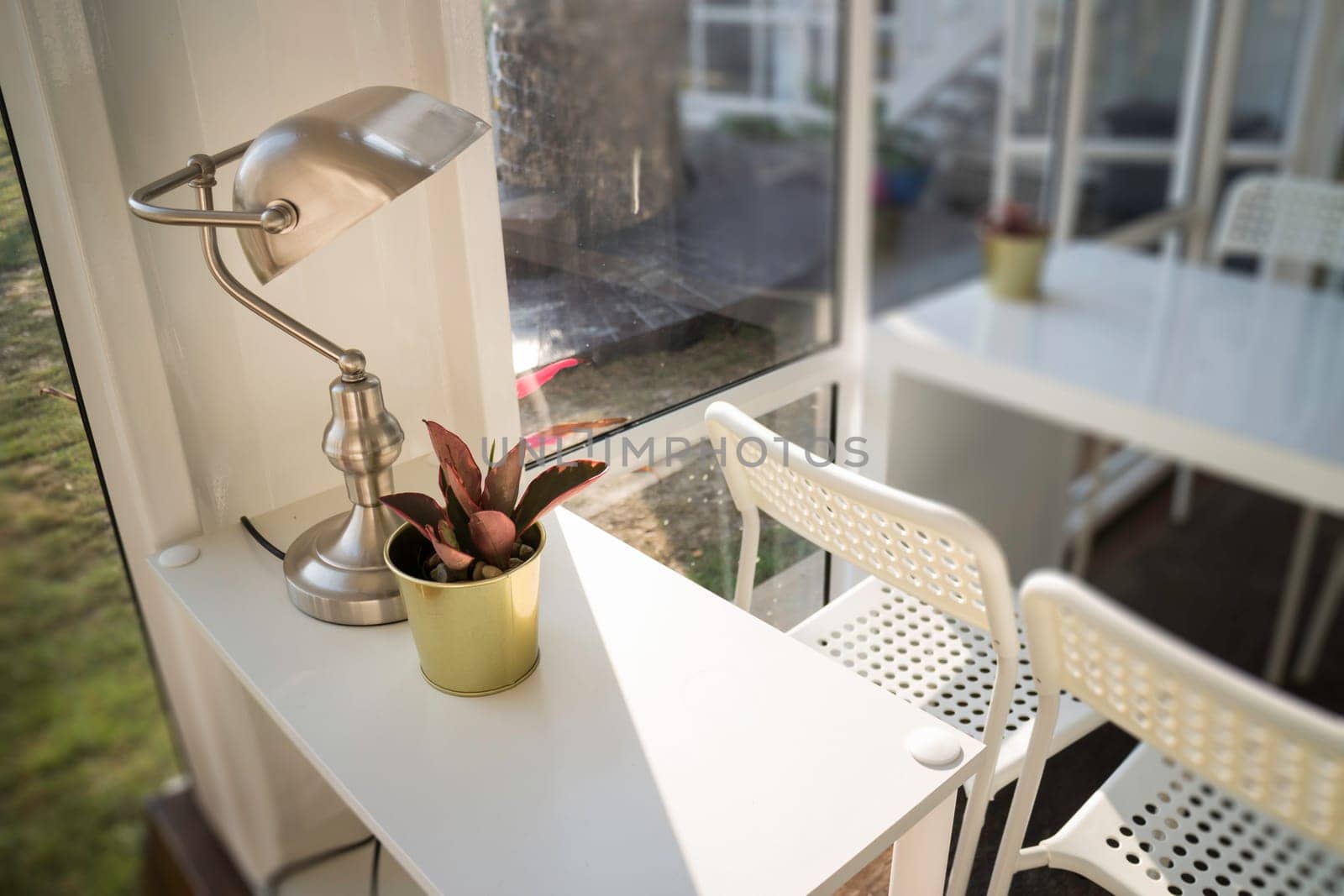 White table and chair in cargo container living room, stock photo