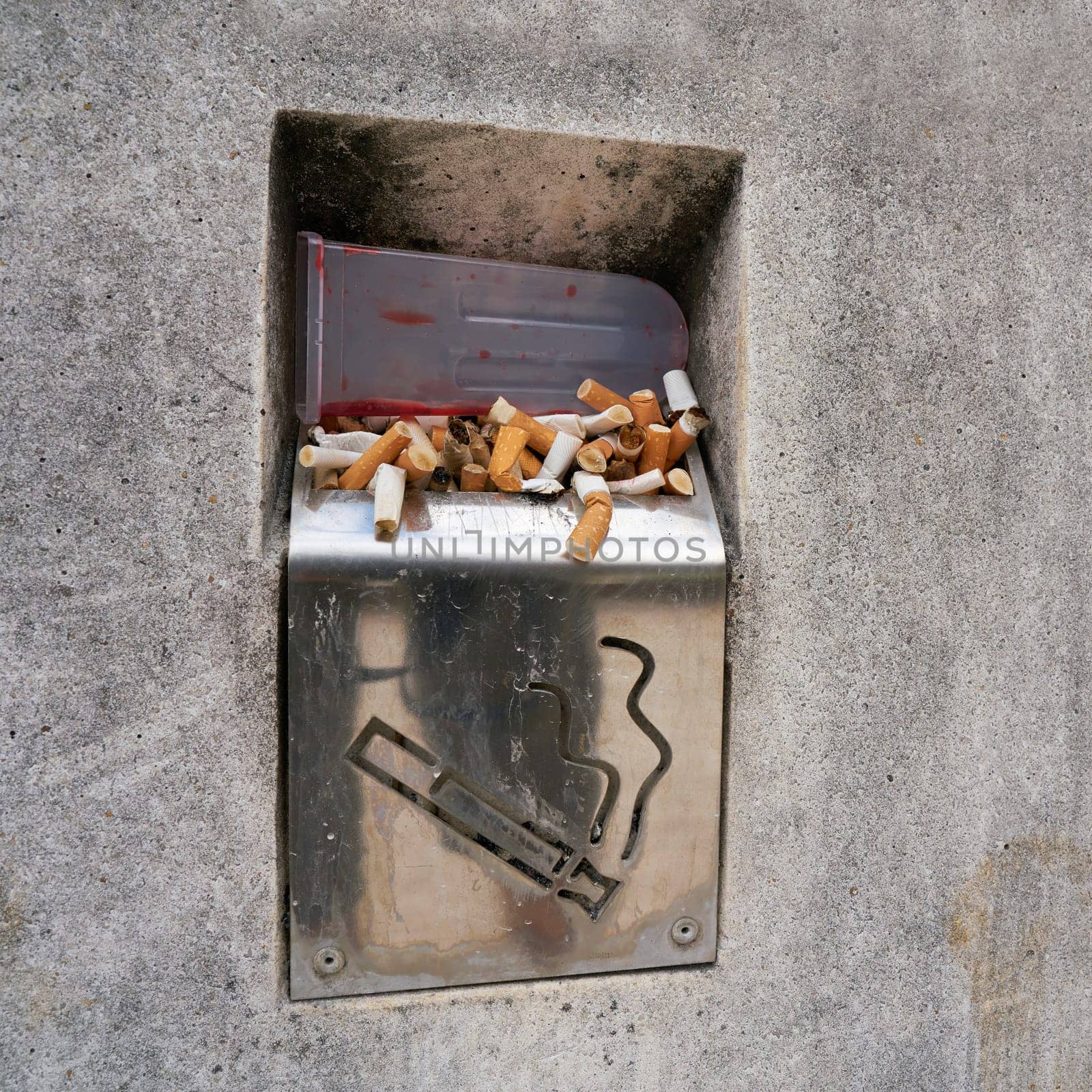 Cigarettes in an ashtray on the wayside in Pula in Croatia
