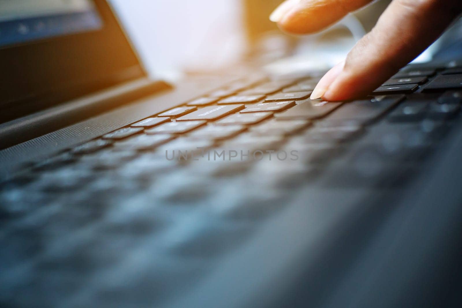 Networking and connecting concept, Keyboard with hand human on notebook computer blurred background