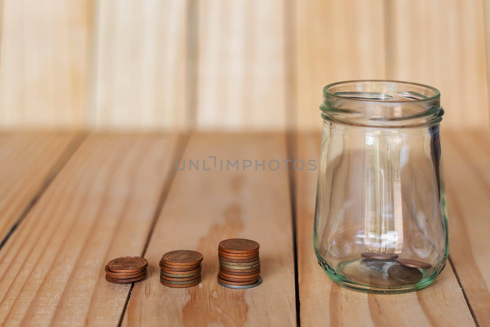 Save money and account banking for finance business concept, Coin money in bottle on business office table, Savings for retirement and investing concept