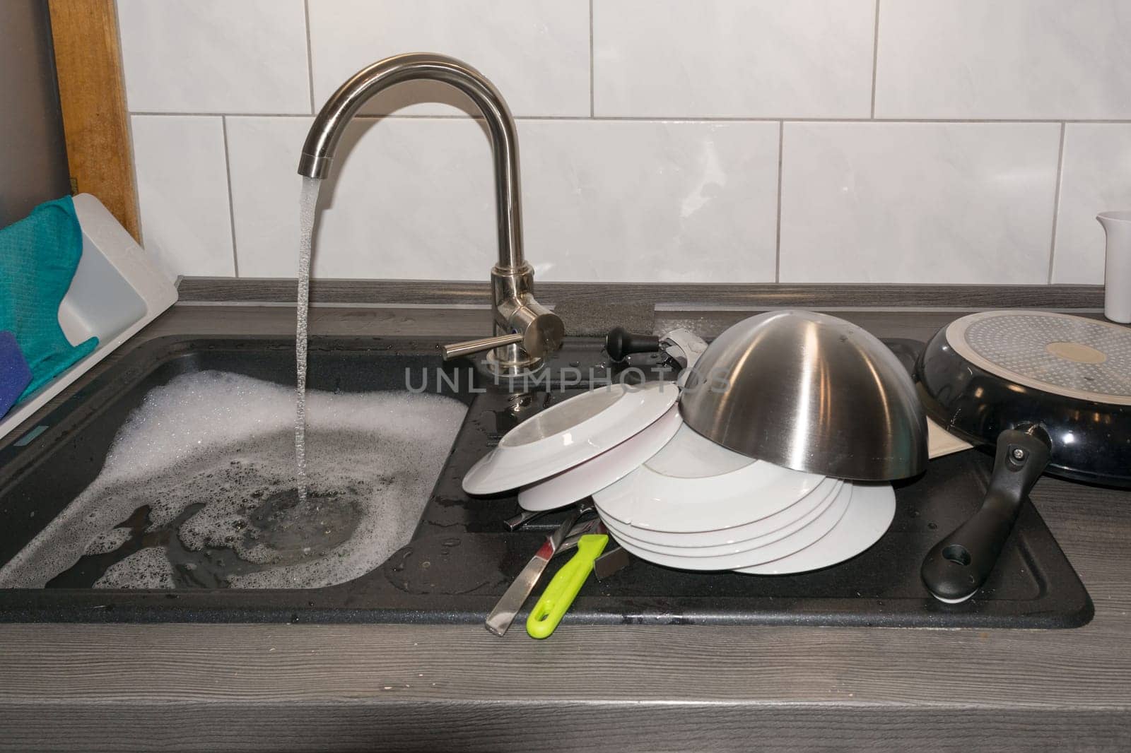 Wash and dry kitchen utensils on the sink by hand