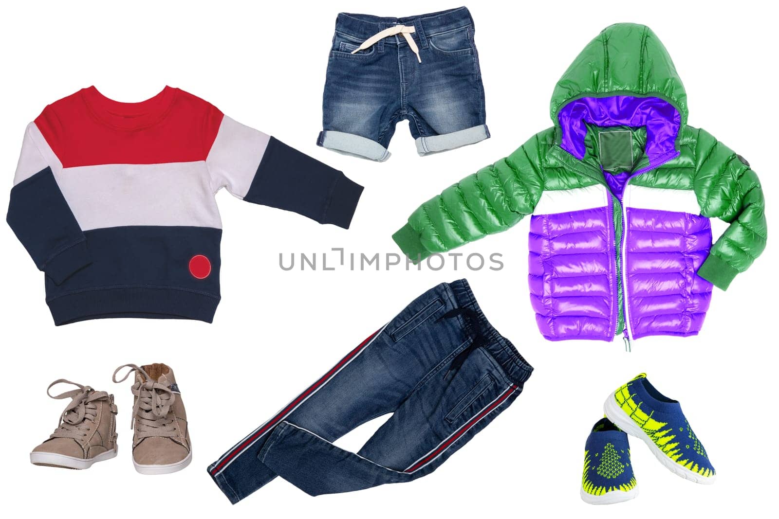 Collage set of children clothes. Denim jeans or pants, short jeans, two pair shoes , rain jacket and a sweater for child boy isolated on a white background. Concept spring autumn and summer clothes.