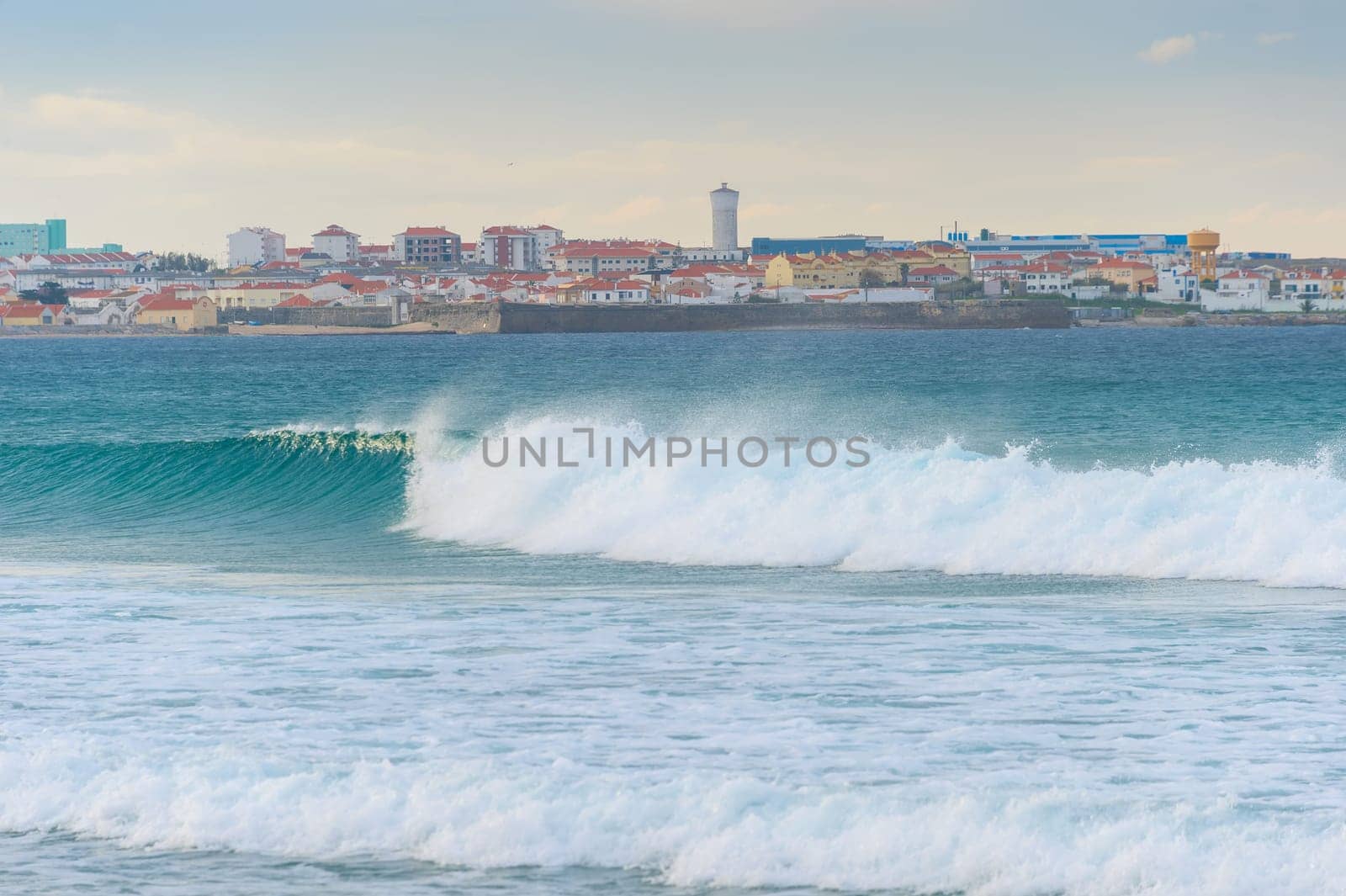 Skyline of Peniche - coastal town in Portugal. Atlantic ocean in the foreground