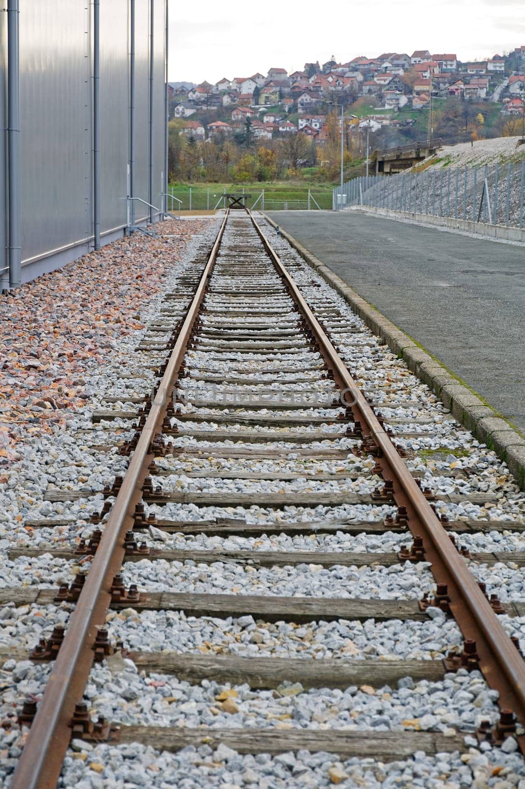 Rail Road Tracks Next to Warehouse Building