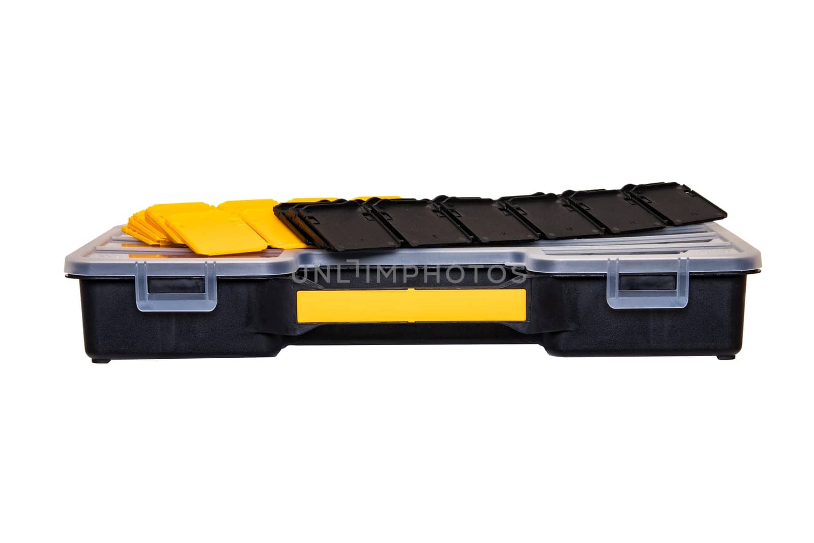 Equipment of craftsman. A empty professional black plastic storage and a lot of black and yellow partitions for setting up compartments isolated on a white background. Handyman accessories.