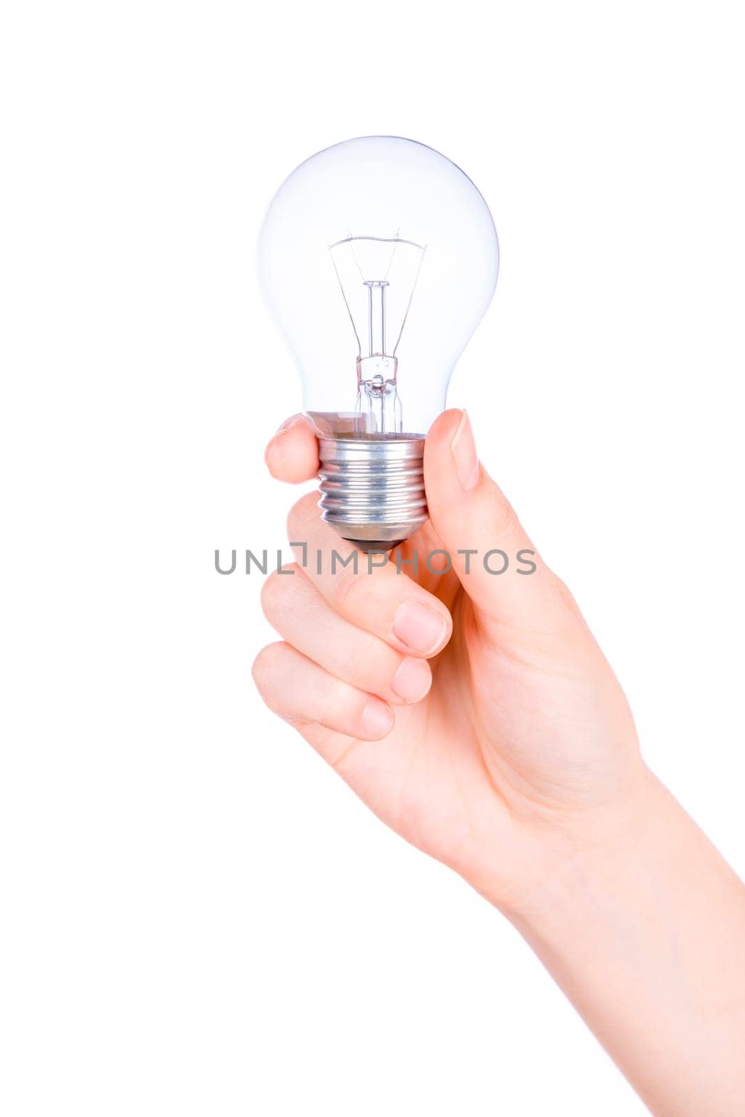 Female hand holding a light bulb on white background