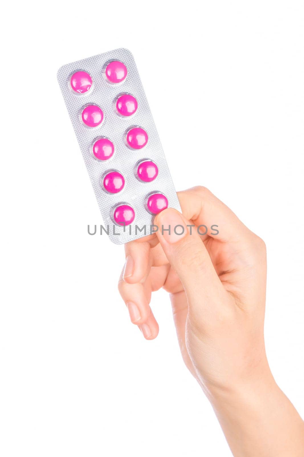 Woman hand holding pills tablet. Female hand holding prescription pill over white background.