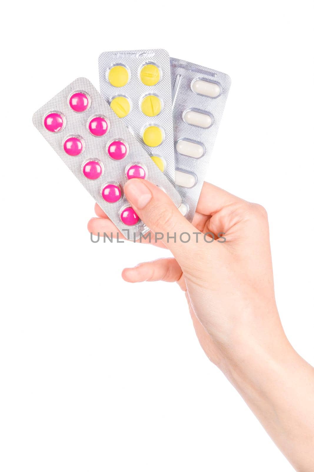 Woman hand holding pills tablet. Female hand holding prescription pill over white background.