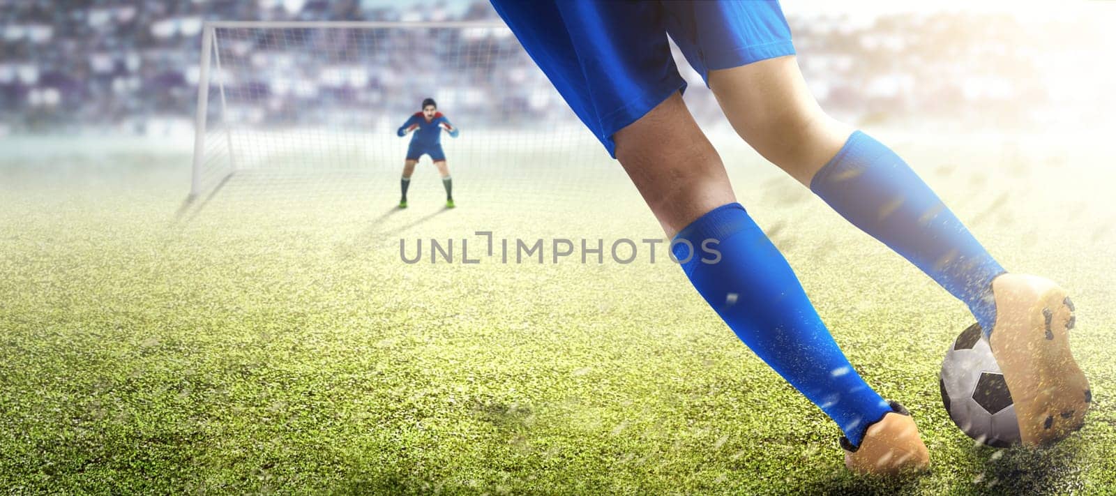 Football player man kicking the ball in the penalty box on football field at stadium